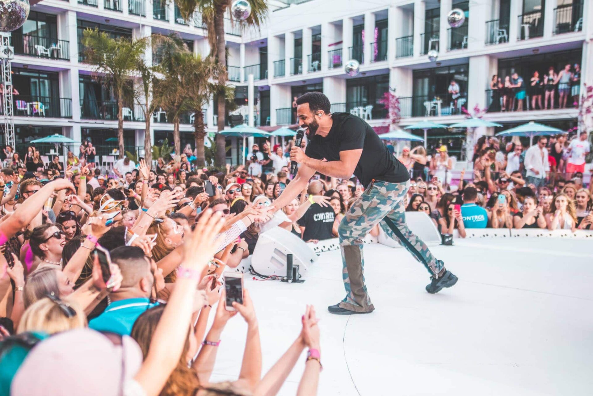 craig dvaid grab fans hands from stages at ibiza rocks