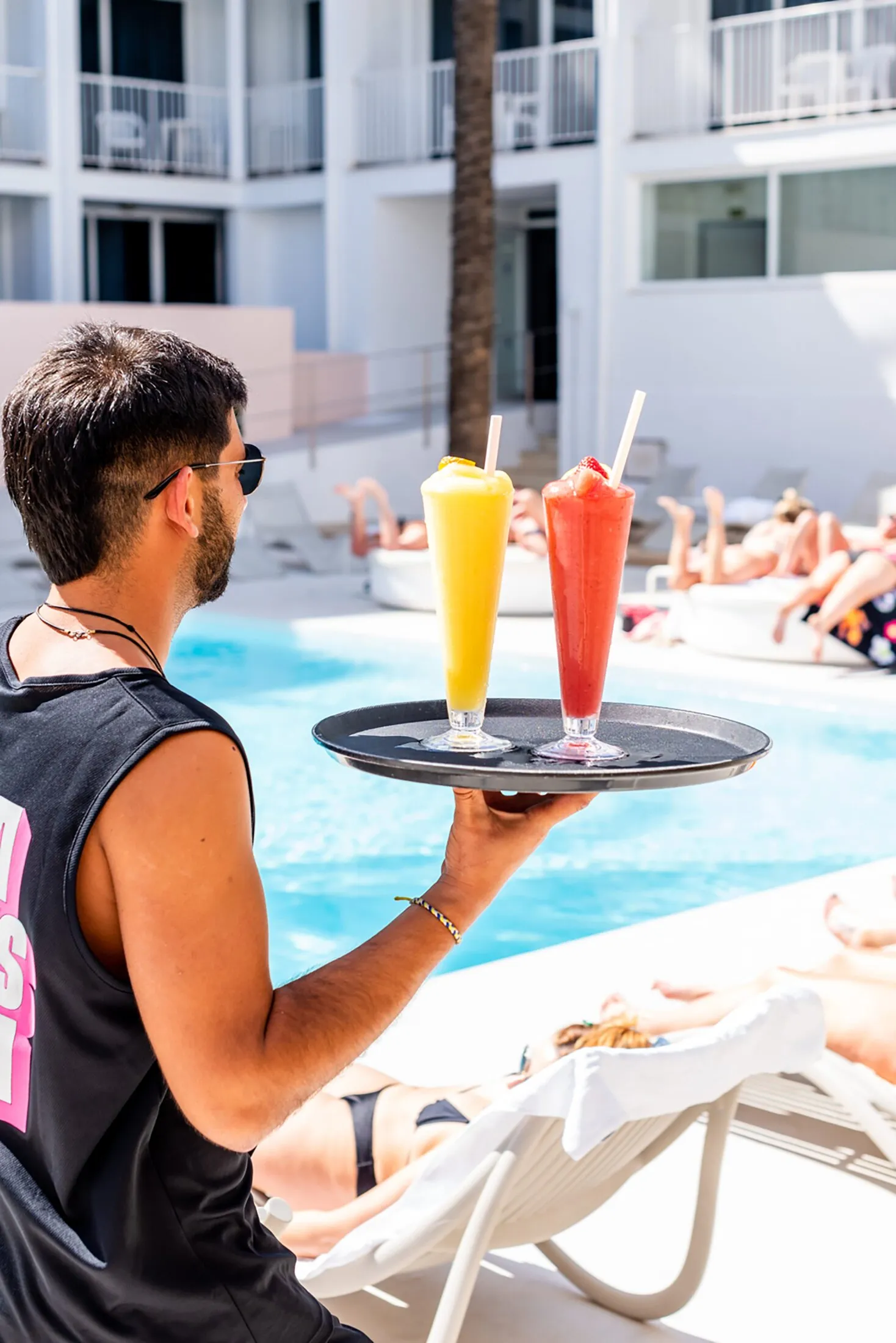 ibiza rocks staff with strawberry and mango daiquiri at the chill out pool