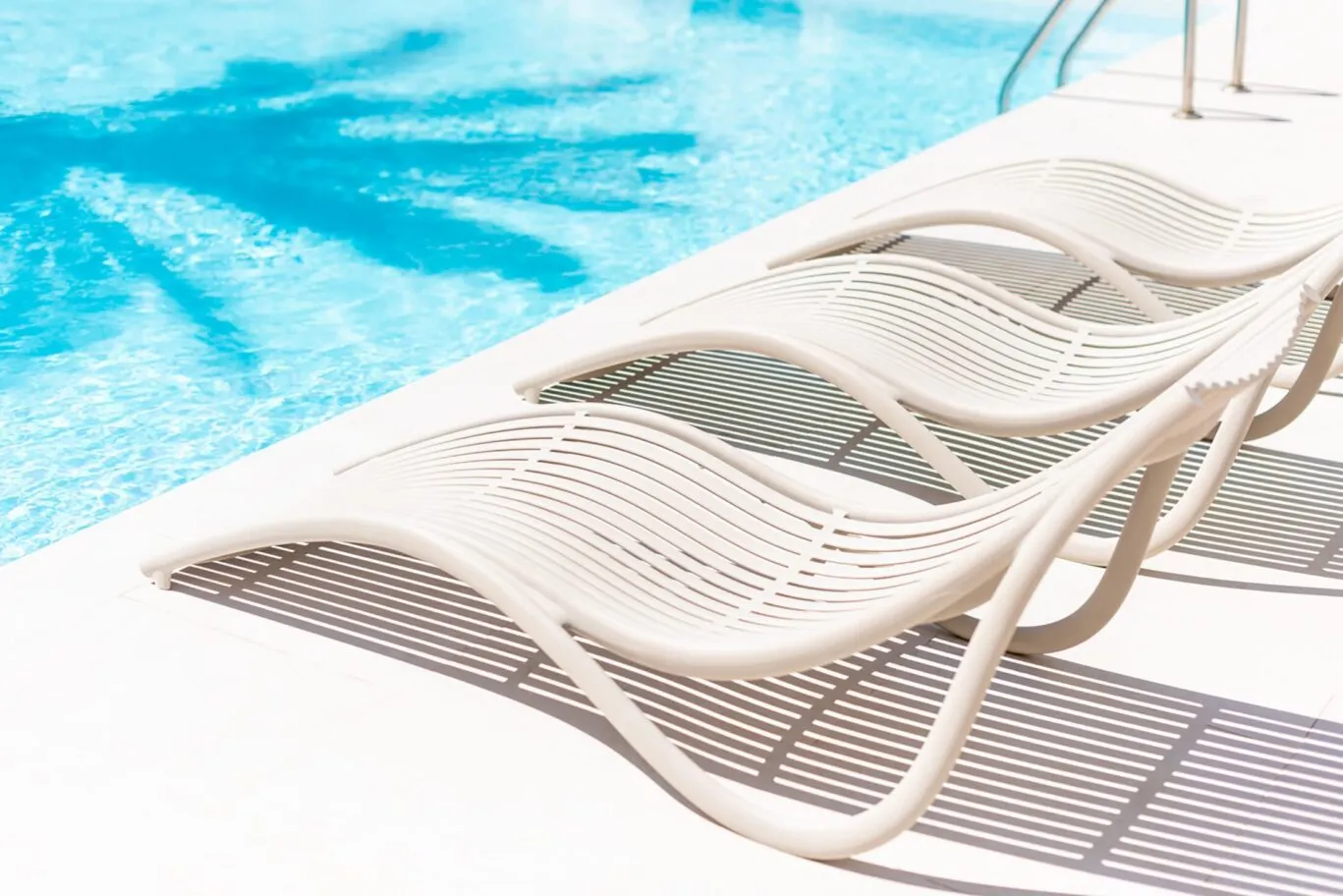 sun loungers by side of the pool chill out pool