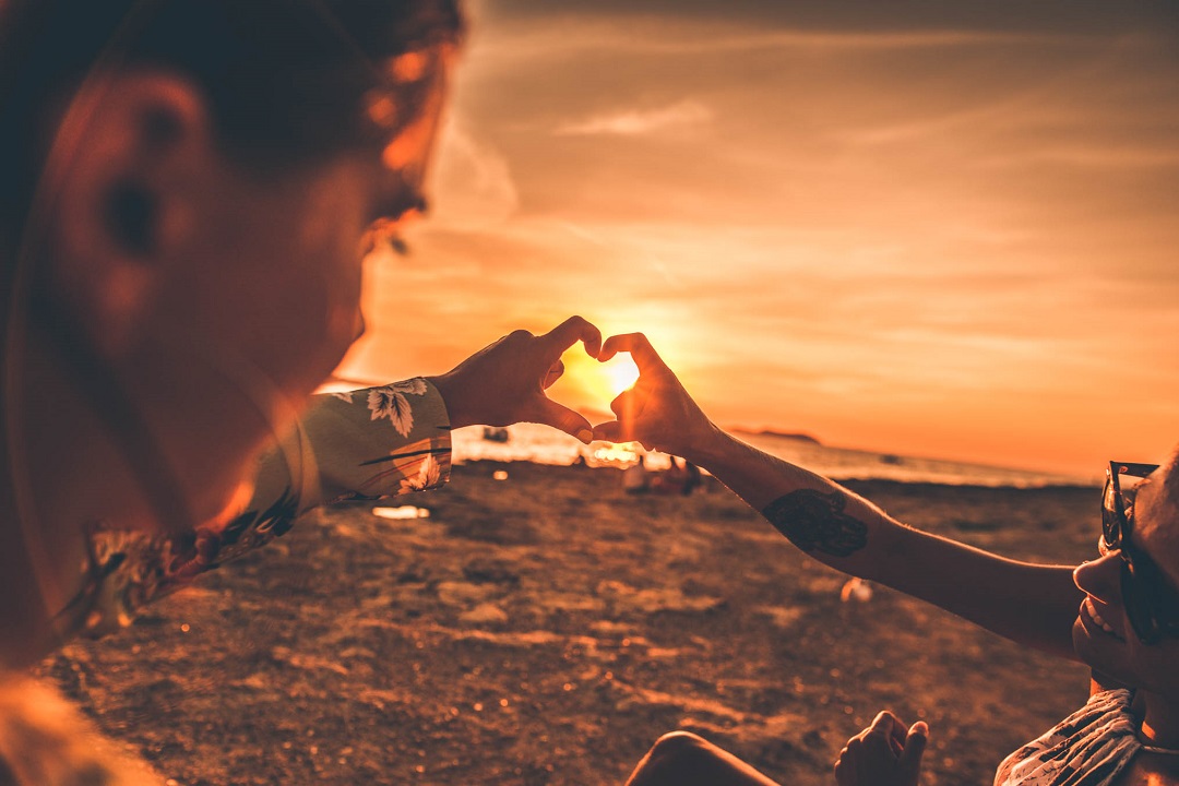Girls enjoying Ibiza sunset | best time to go to ibiza