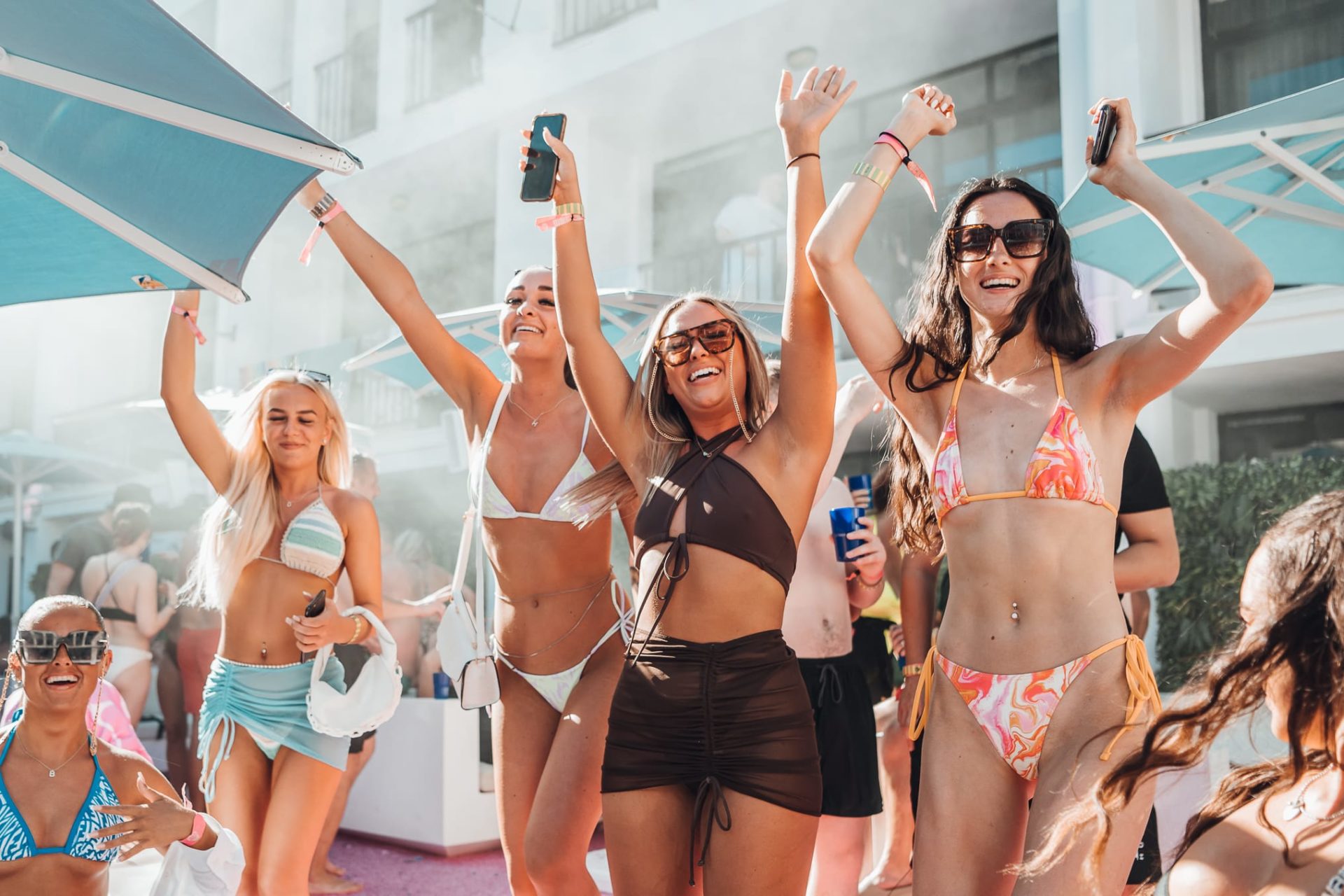 group of girls dancing in ibiza rocks vip at pool party