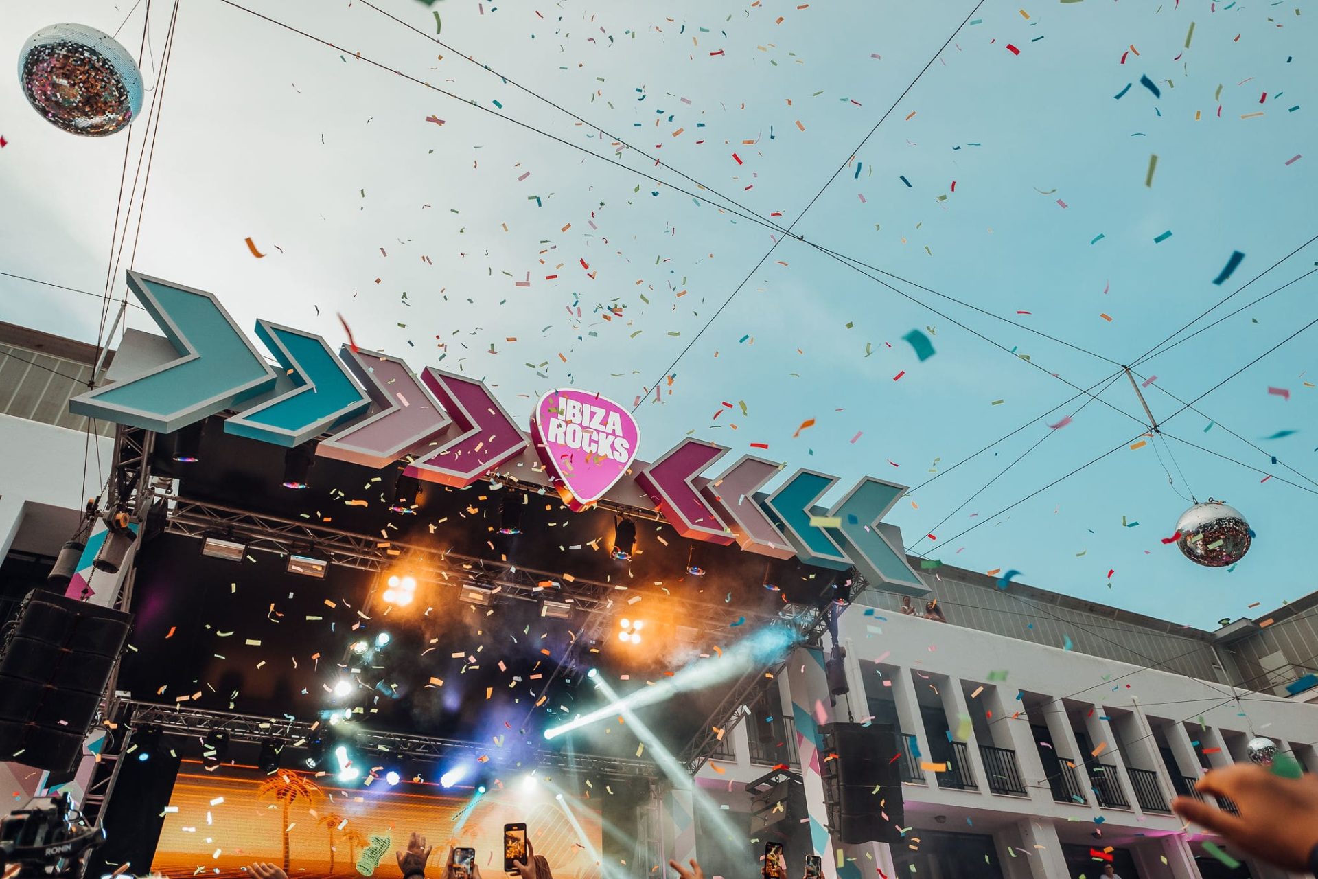 Ibiza Rocks Stage with logo as confetti floats in the sky